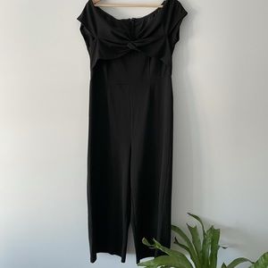Black off shoulder jumpsuit.